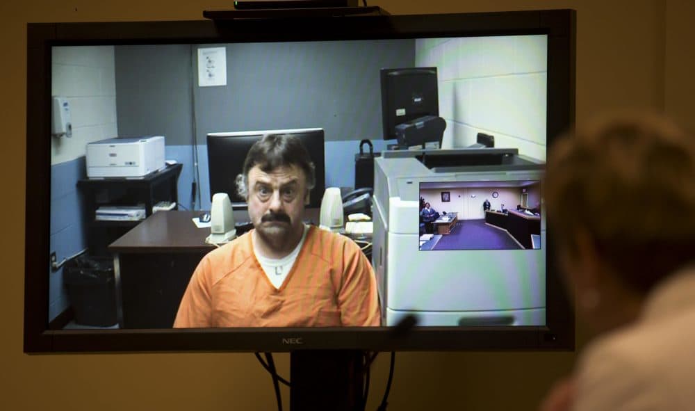 Wendell Noyes appears via a video arraignment from the county jail in Stewartstown, New Hampshire, as prosecutor Jane Young, right, listens in district court in Berlin on Tuesday. (Jim Cole/AP, Pool)