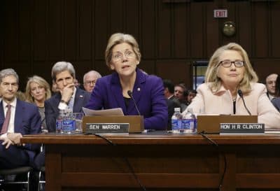 Sen. Elizabeth Warren will join Hillary Clinton on the campaign trail in Ohio on Monday. The senator, pictured here in the center, sits next to Clinton, right, who spoke at John Kerry's confirmation hearing to become secretary of state in 2013. (J. Scott Applewhite/AP)