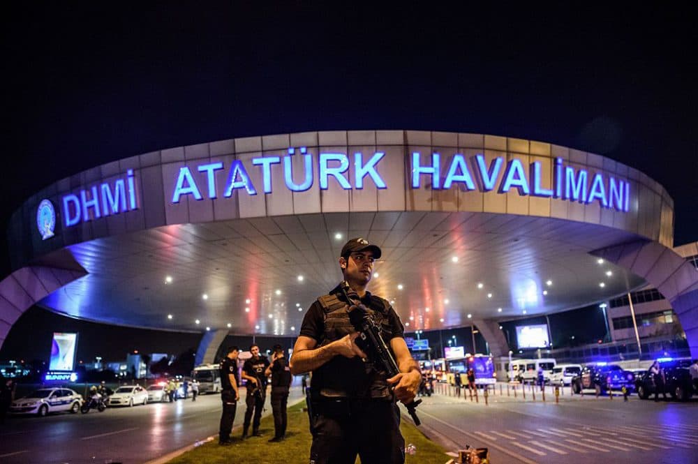 A Turkish riot police officer patrols Ataturk airport's main entrance in Istanbul, on June 28, 2016, after two explosions followed by gunfire hit Turkey's largest airport, killing at least 10 people and injuring 20. All flights at Istanbul's Ataturk international airport were suspended on June 28, 2016 after a suicide attack left at least 36 people dead. (Ozan Kose/AFP/Getty Images)