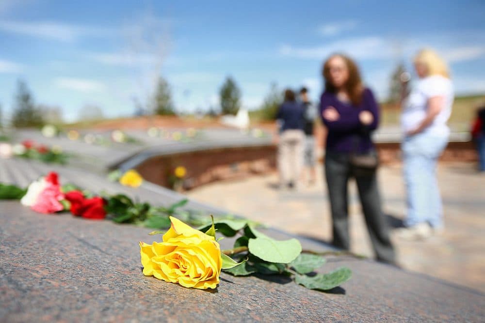 A yellow rose lies on the Columbine Memorial on the 10-year anniversary of the Columbine High School shootings at the Columbine Memorial Park April 20, 2009 in Littleton, Colorado. (Marc Piscotty/Getty Images)