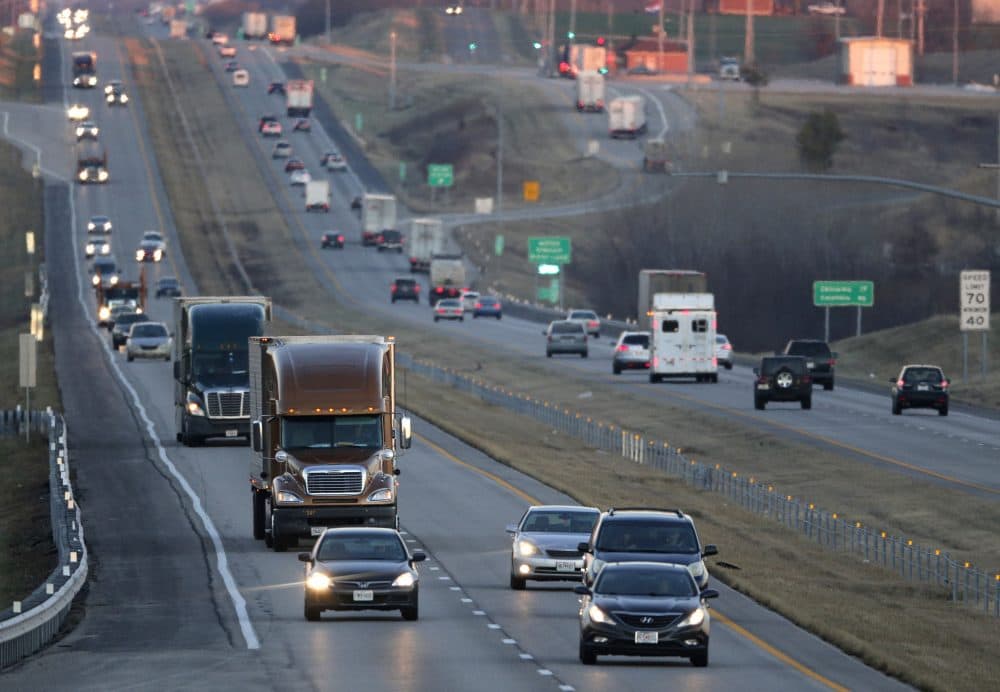 Vehicles travel along Interstate 70 near Odessa, Missouri (Charlie Riedel/AP)