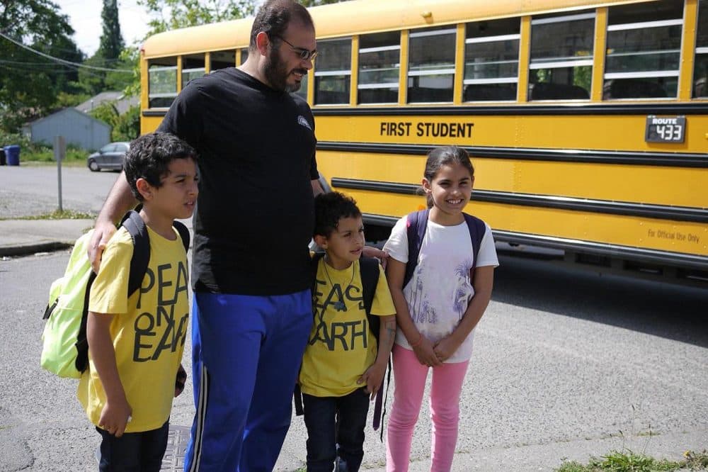 Bassam Alhamdan, father of six, meets his kids at the bus stop every afternoon. (Liz Jones/KUOW)