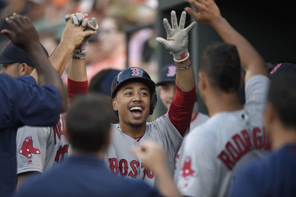 Boston Red Sox' Mookie Betts celebrates the first of three home runs ilast night against the Baltimore Orioles. (Nick Wass/AP)