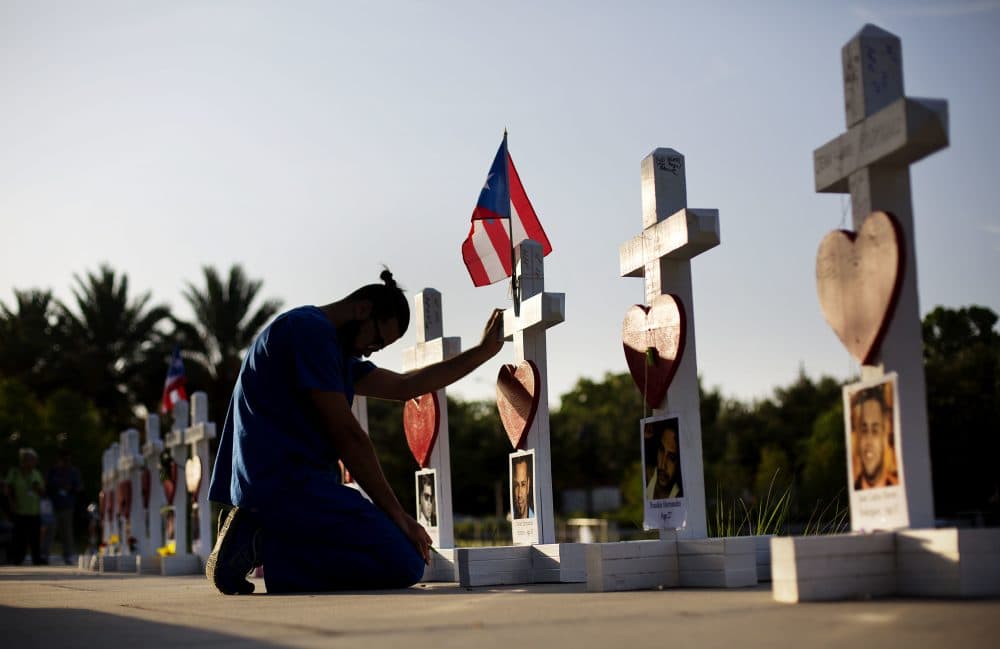 Ernesto Vergne prays at a memorial to those killed in the Pulse nightclub mass shooting in Orlando, Fla. (David Goldman/AP)