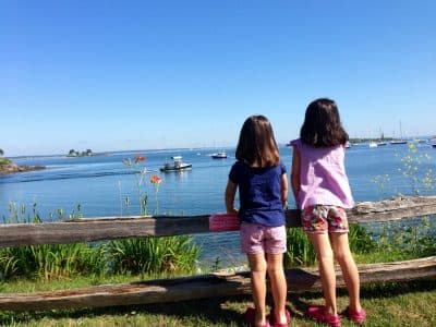 Laura Shea Souza writes that, for one week a year, a rented cottage on the Maine coast feels just like coming home. Pictured: The author's daughters overlooking the harbor in Biddeford, Maine, in 2014. (Author/Courtesy)