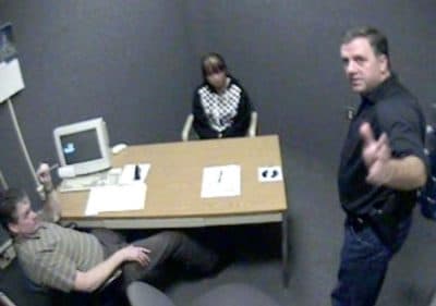 A screenshot of video footage attained by WBUR shows Worcester Police Sgt. Kevin Pageau, right, and Detective John Doherty as they interrogate Nga Truong, then 16, after the 2008 death of her baby boy.