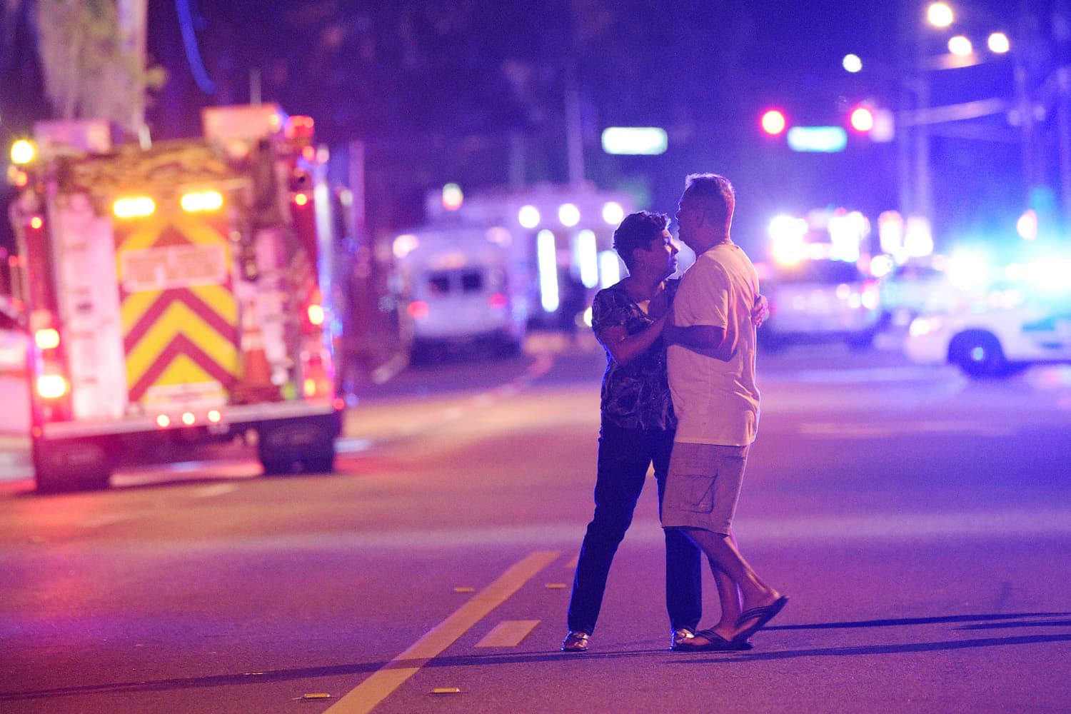 Family members wait for word from police after arriving down the street from a shooting involving multiple fatalities at Pulse Orlando nightclub in Orlando, Fla., Sunday, June 12, 2016. (Phelan M. Ebenhack / AP)