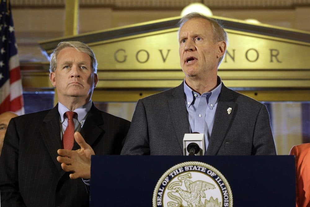 Illinois Gov. Bruce Rauner speaks to reporters in front of his office at the Illinois State Capitol, Thursday, June 30, 2016, in Springfield, Ill. Illinois lawmakers were moved to compromise on a stopgap budget after a year-and-a-half stalemate by a powerful force: a high-stakes November election and a voting public one legislator described as near revolt. (Seth Perlman/AP)