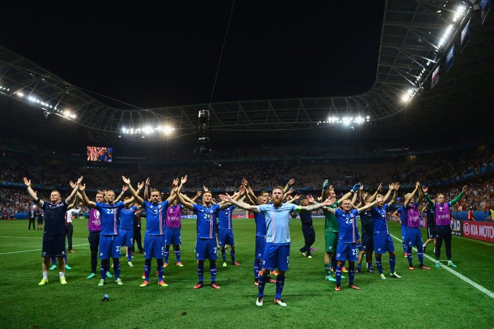 The Icelandic national football team celebrated with their fans following their stunning victory over England. (Dan Mullan/Getty Images)