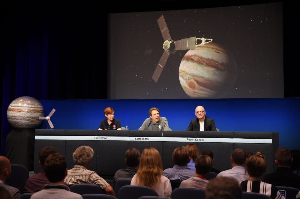 NASA Program Executive Diane Brown (L), Juno Mission Principal Investigator Scott Bolton (C) and Robert Kondrk (R), Apple vice president for Content and Media Apps, attend a press conference at the Jet Propulsion Laboratory (JPL) in Pasadena, California, June 30, 2016. (Robyn Beck/AFP/Getty Images)