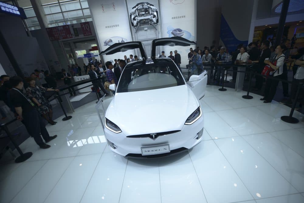 Vistors look at a Tesla Model X on display at the Beijing Auto Show in Beijing on April 25, 2016.
Global carmakers gathered in Beijing on April 25 to show off their wares as competition intensifies and growth slows in the world's biggest auto market, with the key SUV and new energy vehicle sectors the focus of attention. (WANG ZHAO/AFP/Getty Images)