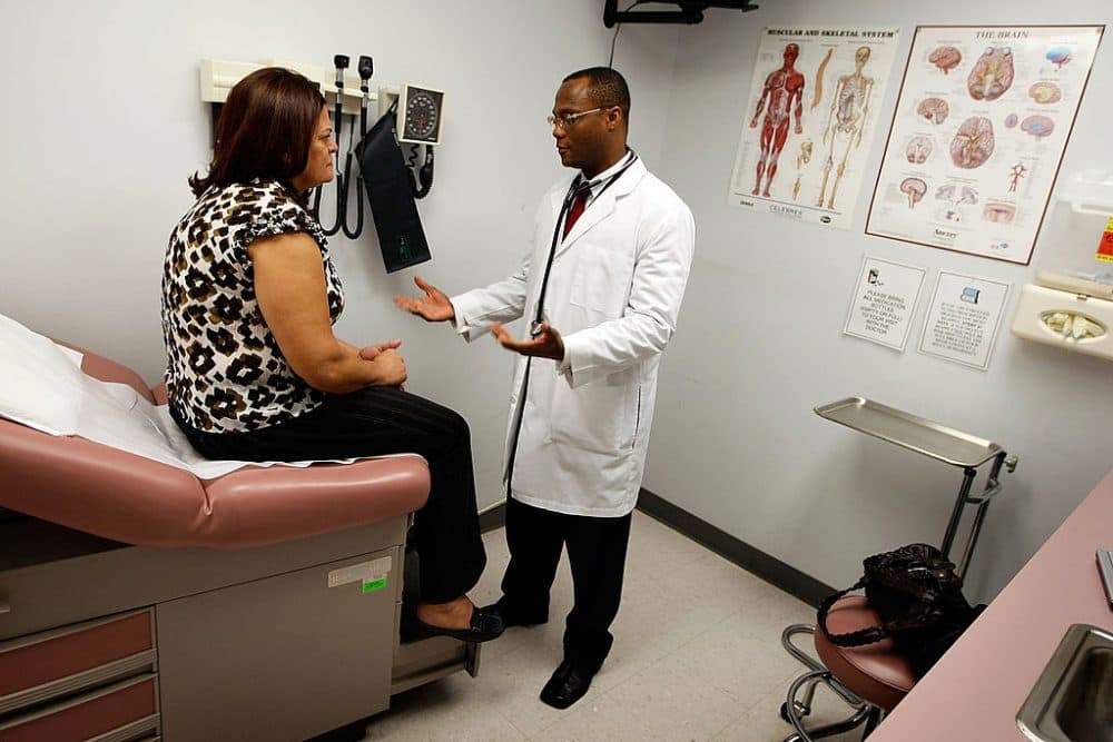 Emlyn Louis, MD speaks with Julia Herrera as he examines her at the Broward Community &amp; Family Health Center on April 20, 2009 in Pompano Beach, Florida. ( Joe Raedle/Getty Images)