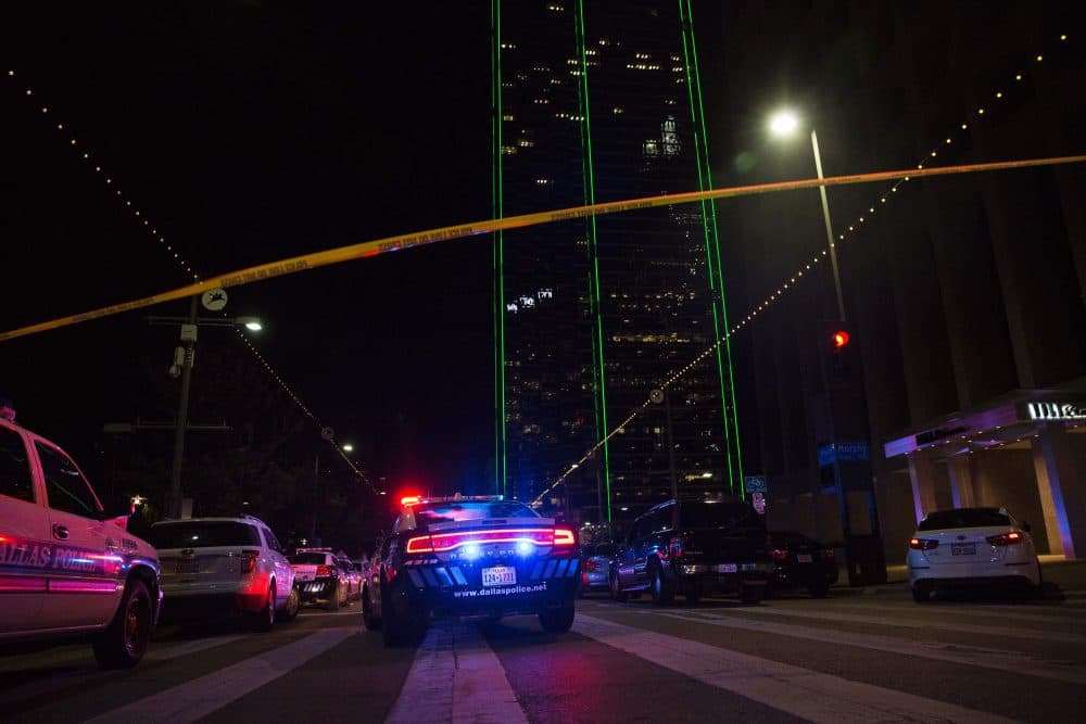 Police cars sit on Main Street in Dallas following the sniper shooting during a protest on July 7, 2016. (Laura Buckman/AFP/Getty Images)