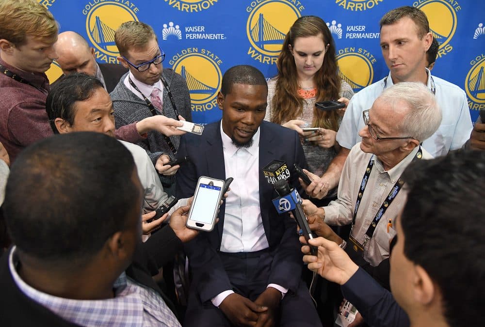 The constant media attention to Kevin Durant and his free agency decision to join the rival Golden State Warriors is one of many off-court storylines the NBA is generating. (Thearon W. Henderson/Getty Images)