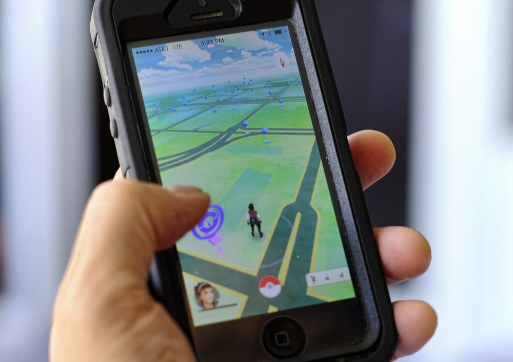 Pokemon Go is displayed on a cell phone in Los Angeles on Friday, July 8, 2016. Just days after being made available in the U.S., the mobile game Pokemon GO has jumped to become the top-grossing app in the App Store. (Richard Vogel/AP)