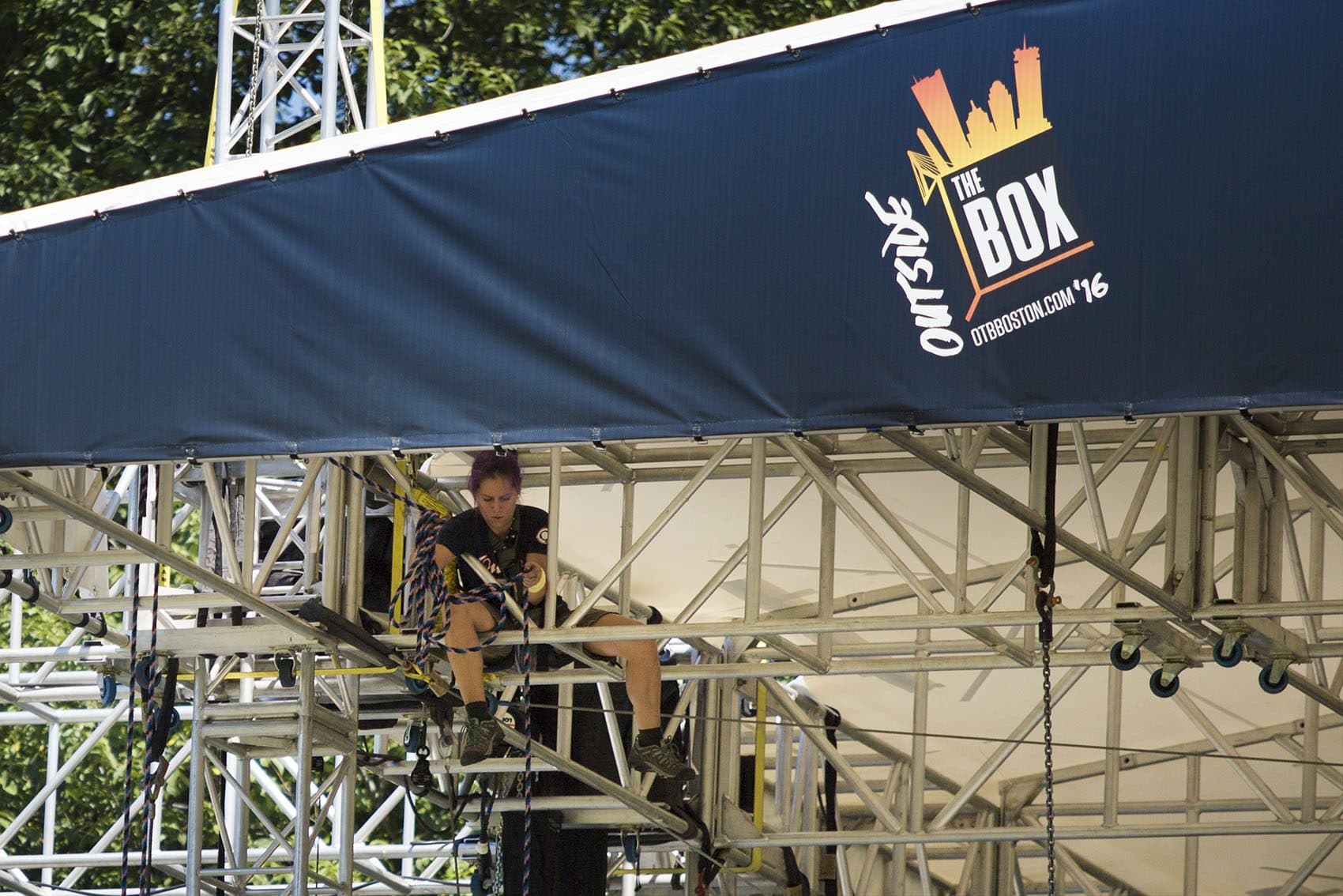A worker prepares one of the venues on the Boston Common for the Outside The Box Festival. (Jesse Costa/WBUR)