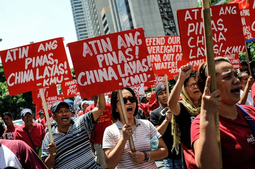 Anti-China protesters mount a rally against China's territorial claims in the Spratlys group of islands in the South China Sea in front of the Chinese Consulate on July 12, 2016 in Makati, Philippines. (Dondi Tawatao/Getty Images)