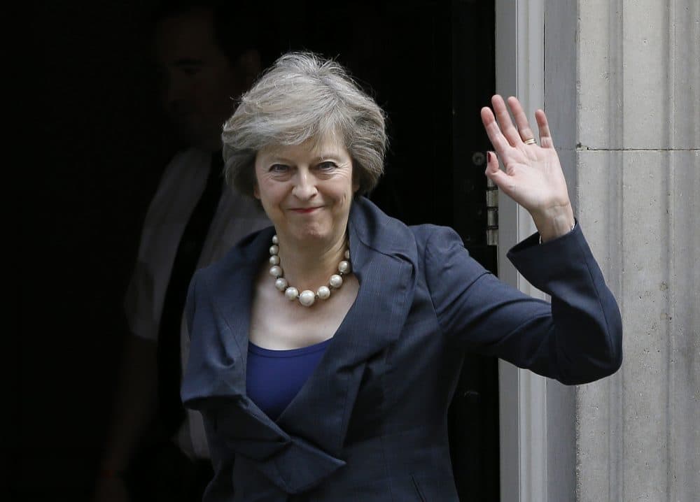 Britain's Home Secretary Theresa May waves towards the media as she arrives to attend a cabinet meeting at 10 Downing Street, in London, Tuesday, July 12, 2016. (Kirsty Wigglesworth/AP)