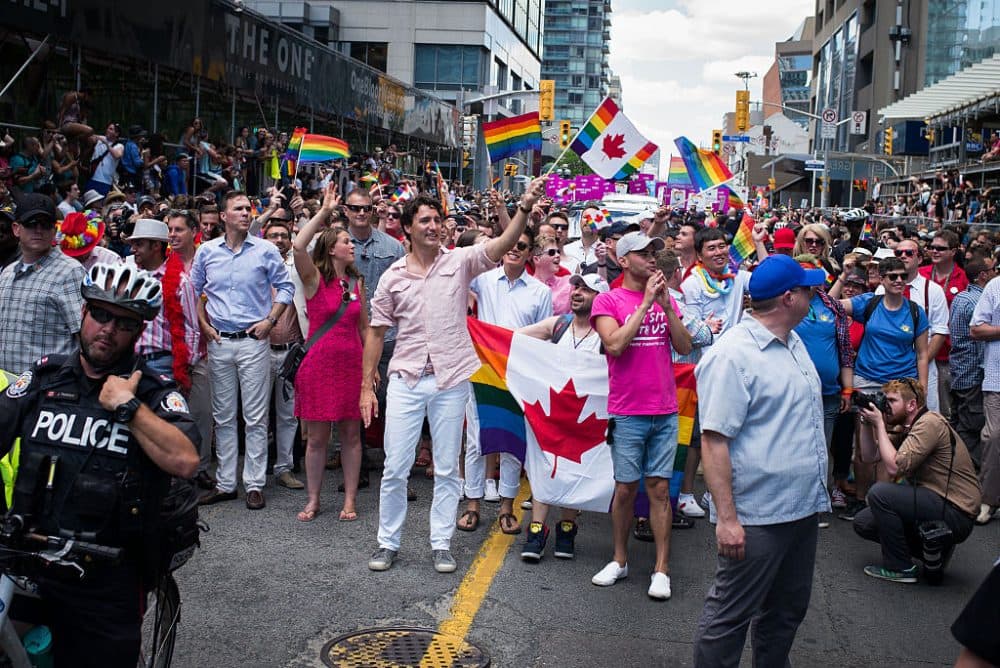 Canadian Prime Minister Justin Trudeau (middle, holding flag) participates at the annual Pride Festival parade, July 3, 2016 in Toronto, Ontario, Canada. Prime Minister Justin Trudeau will make history as the first Canadian PM to march in the parade. (Ian Willms/Getty Images)