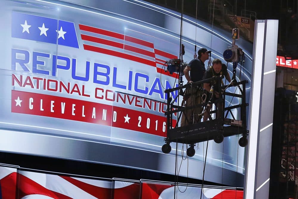 The main stage on the convention floor at the Quicken Loans Arena in downtown Cleveland, Ohio, is prepared for the upcoming Republican National Convention, as workers stand in a man lift on Wednesday, July 13, 2016. (Gene J. Puskar/AP)
