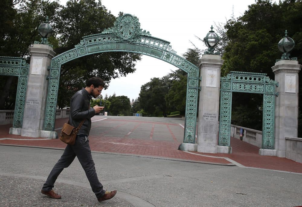 A pedestrian walks by Sather Gate on the UC Berkeley campus on May 22, 2014 in Berkeley, California. (Justin Sullivan/Getty Images)