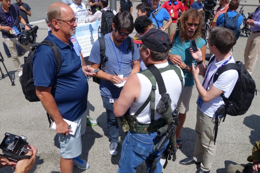 Steve Thacker (center), a member of a group supporting the carrying of weapons, openly speaks to the media at an open carry event July 17, 2016 in Cleveland, Ohio, site of the Republican National Convention. (William Edwards/AFP/Getty Images)