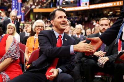 Wisconsin Gov. Scott Walker shakes hands with a delegate on the first day of the Republican National Convention on July 18, 2016 at the Quicken Loans Arena in Cleveland, Ohio. (Joe Raedle/Getty Images)