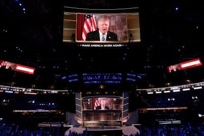 Republican presidential candidate Donald Trump is seen speaking on a screen from New York City, on the second day of the Republican National Convention on July 19, 2016 at the Quicken Loans Arena in Cleveland, Ohio. Republican presidential candidate Donald Trump received the number of votes needed to secure the party's nomination. An estimated 50,000 people are expected in Cleveland, including hundreds of protesters and members of the media. (Alex Wong/Getty Images)