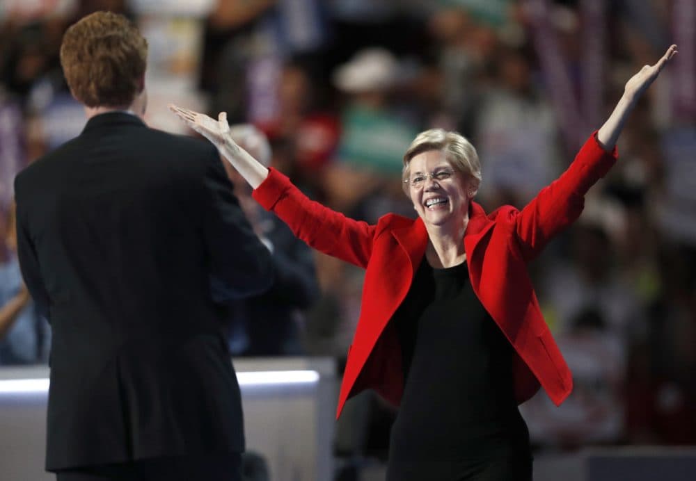 Sen. Elizabeth Warren greets Rep. Joe Kennedy after he introduced her to the crowd at the DNC in Philadelphia Monday night. (Paul Sancya/AP)