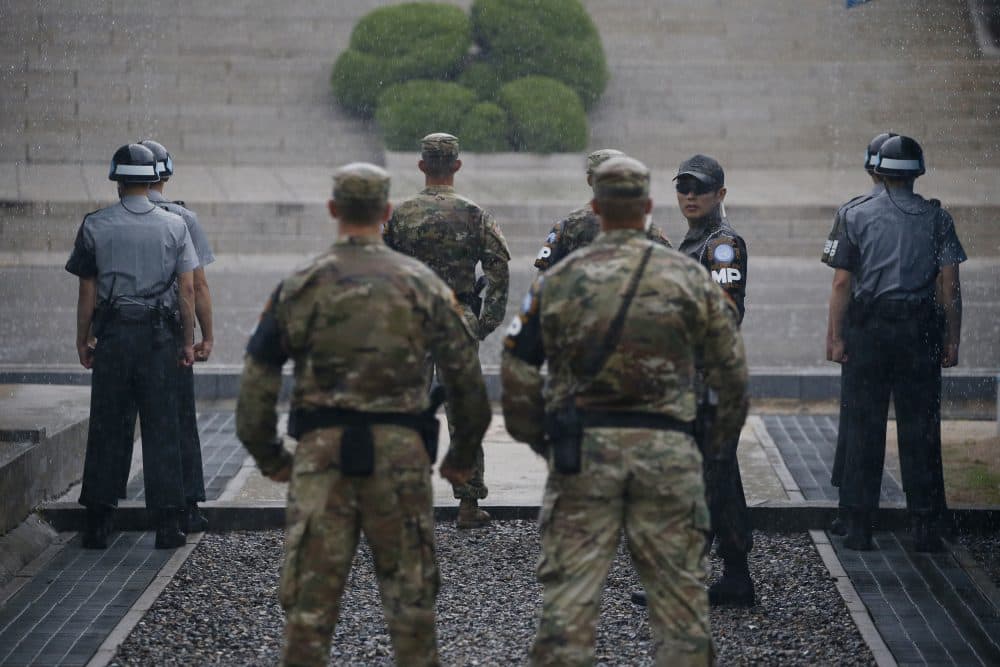 South Korea and U.S. soldiers stand guard during a ceremony marking the 63rd anniversary of the signing of the Korean War ceasefire armistice agreement at the truce village of Panmunjom, along the Demilitarized Zone (DMZ) on July 27, 2016. (Kim Hong-Ji/AFP/Getty Images)