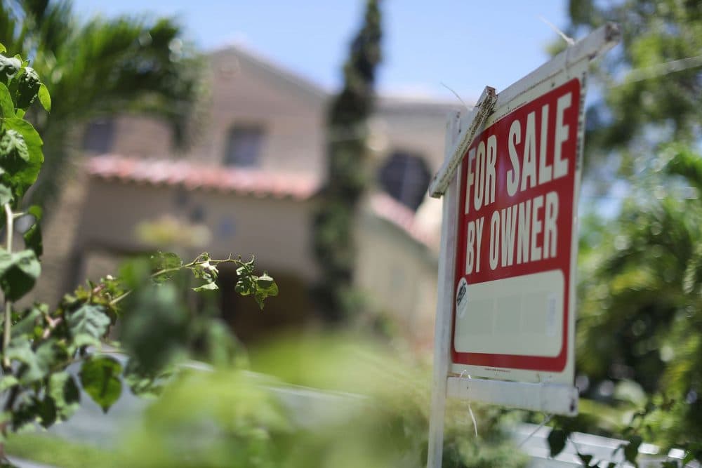 A for sale sign is seen in front of a home on June 22, 2016 in Miami, Florida. (Joe Raedle/Getty Images)