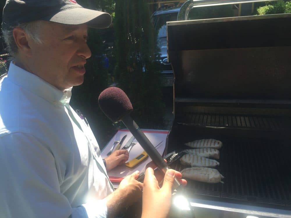 Greg Blonder, co-author of &quot;Meathead: The Science of Great Barbecue and Grilling,&quot; demonstrates four ways to grill a chicken. (Alison Bruzek/WBUR)