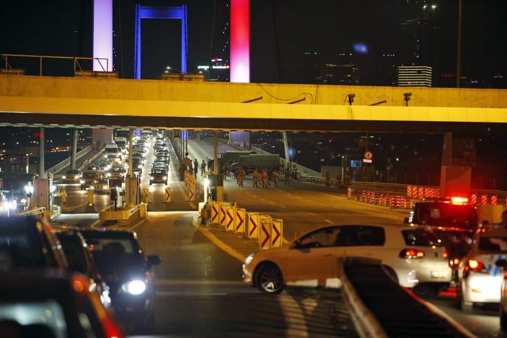 Turkish soldiers block Istanbul's iconic Bosporus Bridge on Friday. The bridge was lit in the colors of the French flag in solidarity with the victims of Thursday's attack in Nice. A group within Turkey's military has engaged in what appeared to be an attempted coup, the prime minister said. (Emrah Gurel/AP)