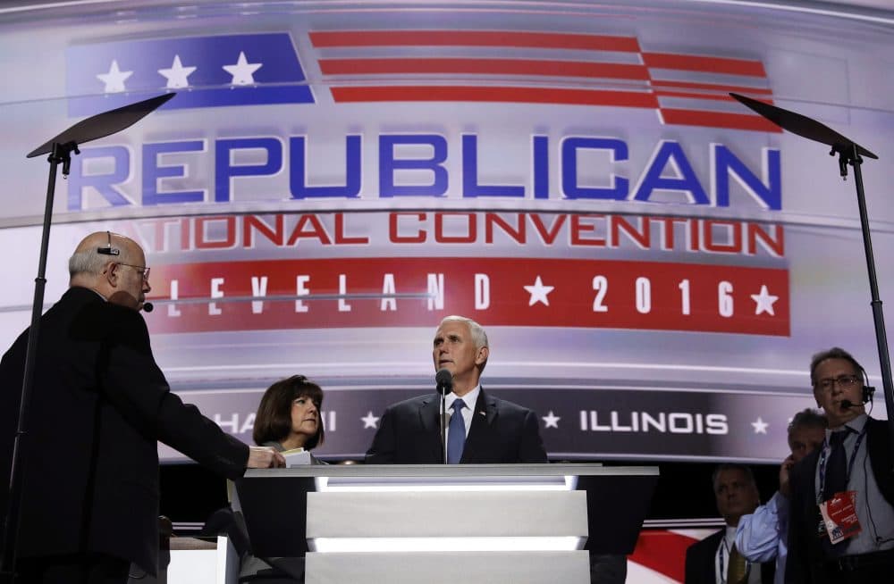 Vice Presidential nominee Gov. Mike Pence and his wife Karen stand on stage before the third day session of the GOP 2016 Convention. (John Locher/AP)