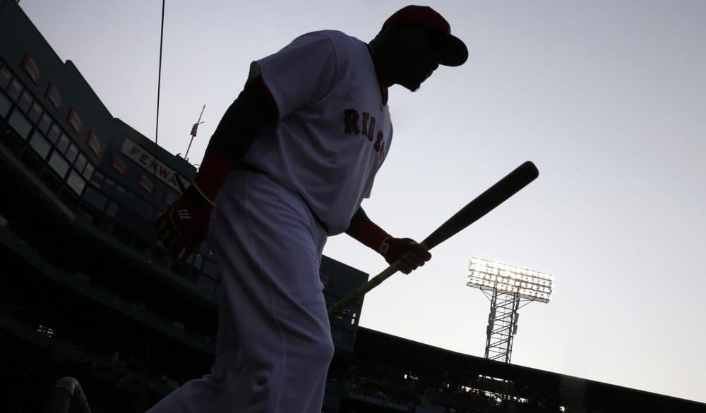 Boston Red Sox designated hitter David Ortiz walks from the dugout to warm up prior to a baseball game against the San Francisco Giants at Fenway Park, Wednesday, July 20, 2016, in Boston. (AP Photo/Charles Krupa)
