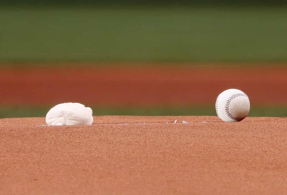 A rosin bag and a baseball on the pitchers mound at Fenway Park (Winslow Townson/AP)