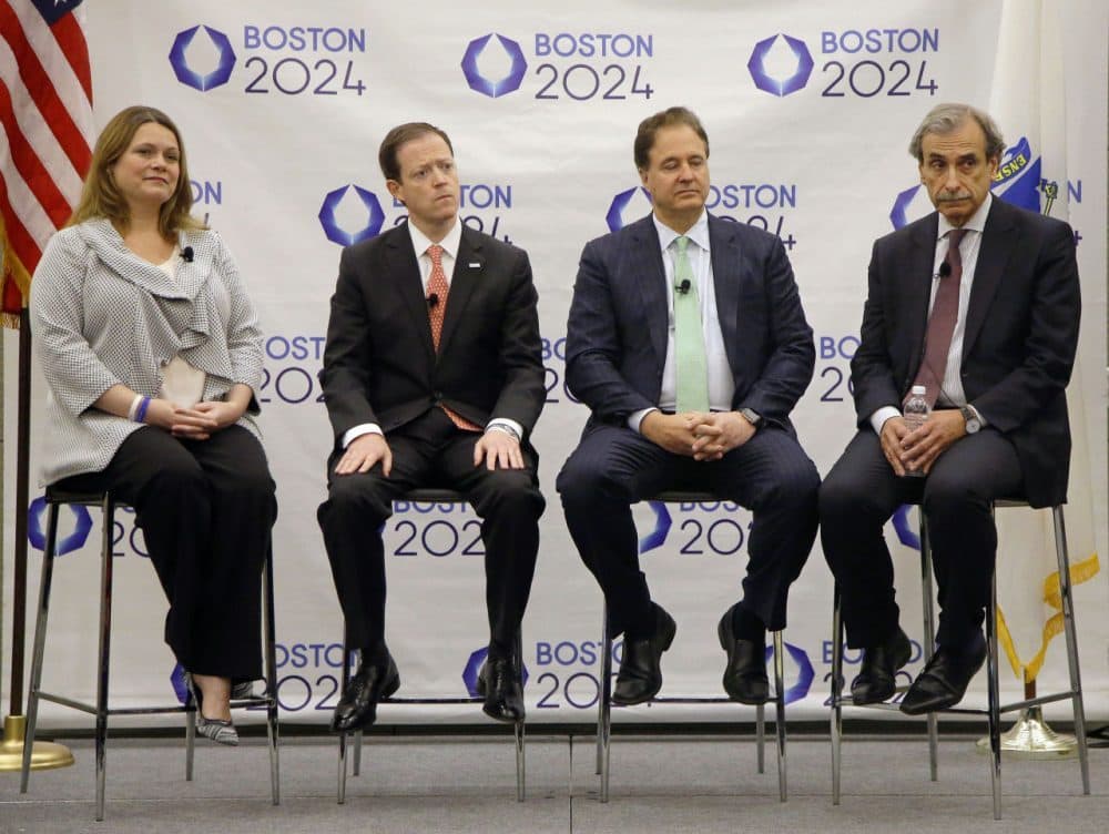 From left to right, Boston 2024 COO Erin Murphy, CEO Rich Davey, Chairman Steve Pagliuca and architect David Manfredi listen to questions during a media availability in 2015 after releasing the group's revised bid for the 2024 Summer Olympics. (Stephan Savoia/AP)