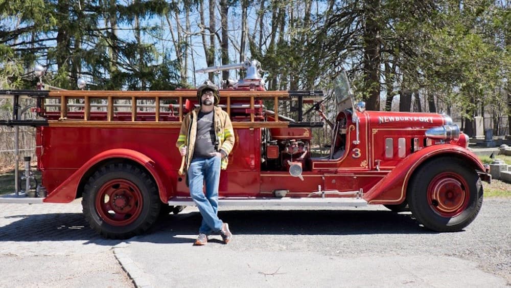 Joe Hill poses with a firetruck for his latest novel, &quot;The Fireman&quot; (Courtesy Jen Salt)