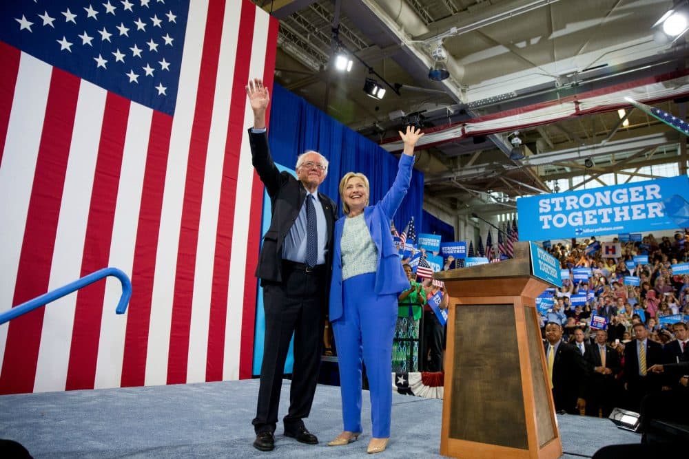 Bernie Sanders has endorsed Hillary Clinton. Renee Graham says that his supporters, as testy and heartbroken as they may now be, need to do the same. Pictured: Democratic presidential candidate Hillary Clinton and Sen. Bernie Sanders, I-Vt., wave to supporters as Sanders endorses Clinton during a rally in Portsmouth, N.H., Tuesday, July 12, 2016. (Andrew Harnik/AP)