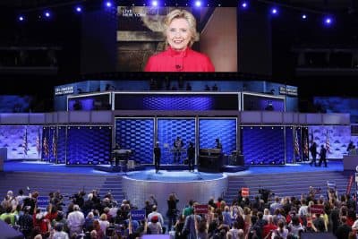 Via live video from New York on the night of her nomination, Democratic presidential candidate Hillary Clinton tells the DNC crowd, &quot;We just put the biggest crack in that glass ceiling yet.&quot; (J. Scott Applewhite/AP)