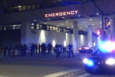 Police and others gather at the emergency entrance to Baylor Medical Center in Dallas, where several police officers were taken after shootings. (Emily Schmall/AP)