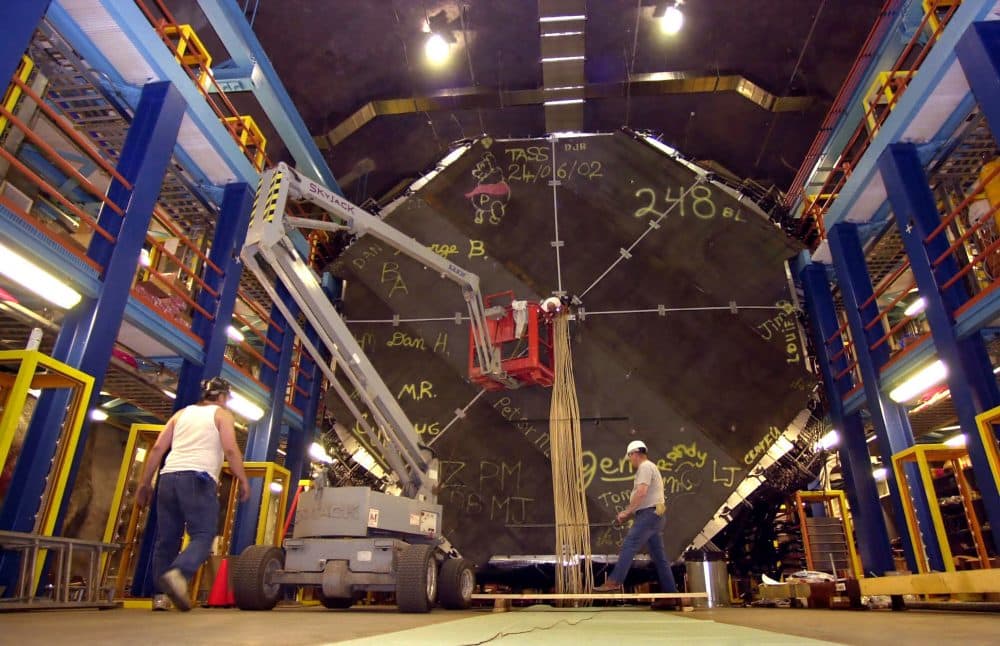 Workers finish construction of the first MINOS super module located in the Soudan Underground Laboratory a half mile below the earth's surface near Soudan, Minnesota. The unit is used to study neutrinos, tiny particles similar to electrons but without an electric charge. Researchers at MIT used data from this module in their recent study. (Eric Miller/AP)