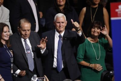 Republican vice presidential candidate Gov. Mike Pence, R-Ind., gives a thumbs up standing next to wife Karen and former Republican presidential candidate Sen. Bob Dole during the opening day of the Republican National Convention in Cleveland (Paul Sancya/AP)