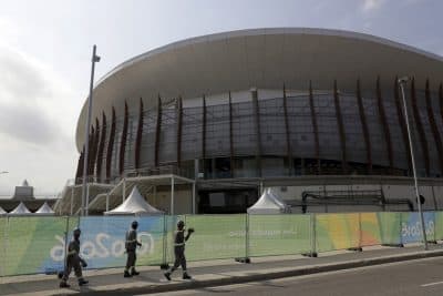 Construction workers walk inside Olympic Park as preparations take place for the 2016 Rio de Janeiro Games in Rio de Janeiro, Brazil. (Patrick Semansky/AP)