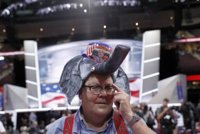 Indiana delegate William Springer wears an elephant hat with Trump button as he walks around the convention floor before the evening session of the first day of the Republican National Convention in Cleveland, (Carolyn Kaster/AP)