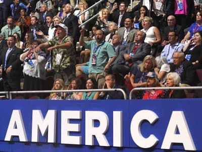 Attendees shout as Texas Sen. Ted Cruz delivers his speech at the Republican National Convention in Cleveland on Wednesday. He was booed once it became clear that he wasn't not going to endorse Republican presidential candidate Donald Trump. (Mark J. Terrill/AP)