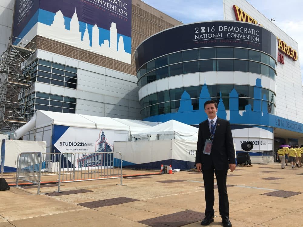 Trevor Doiron, 17 -- one of the youngest delegates at the Democratic National Convention -- stands in front of the Wells Fargo Center entrance, where the convention is being held in Philadelphia. (Shannon Dooling/WBUR)