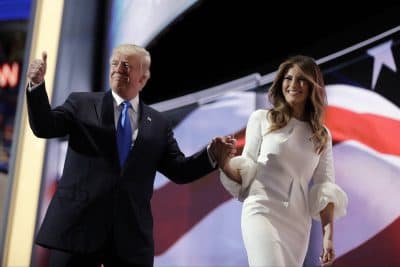 Republican presidential candidate Donald Trump gives his thumb up as he walks off the stage with his wife Melania during the Republican National Convention. (John Locher/AP)