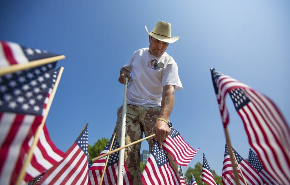Carlos Arredondo planted flags on the Boston Common ahead of Memorial Day earlier this year. His son Alexander Arredondo was killed in Iraq in 2004. (Jesse Costa/WBUR)