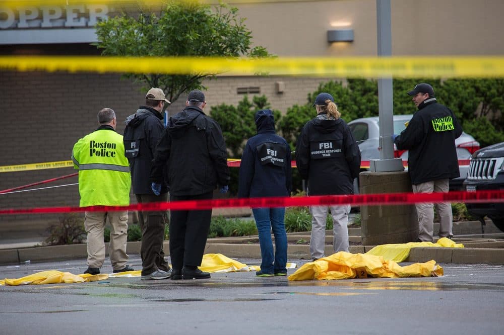 Authorities examine the scene after the fatal shooting of Usaamah Rahim in June, 2015. (Jesse Costa/WBUR)